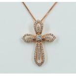 A GOLD AND DIAMOND PENDANT CROSS WITH A GOLD NECKCHAIN