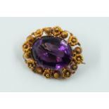 A VICTORIAN GOLD AND AMETHYST BROOCH