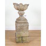 A LATE 19TH CENTURY COMPOSITION STONE URN ON PEDESTAL