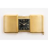 A MOVADO ERMETO GOLD FOLDING TRAVEL WATCH