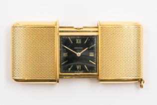 A MOVADO ERMETO GOLD FOLDING TRAVEL WATCH