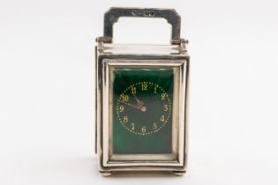 A SILVER AND GREEN ENAMELLED TRAVELLING CARRIAGE CLOCK TIMEPIECE