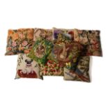 A GROUP OF TEN VARIOUS WOOL NEEDLEPOINT CUSHIONS INCLUDING TWO DEPICTING SEATED PUG DOGS (10)