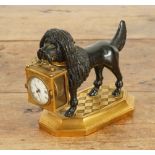 A FRENCH GILT AND PATINATED BRONZE DOG TIMEPIECE