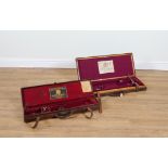 HOLLAND & HOLLAND: AN OAK LINED AND LEATHER BOUND DOUBLE GUN CASE AND ANOTHER SINGLE GUN CASE (2)