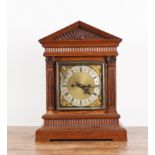 AN OAK CASED MANTLE CLOCK