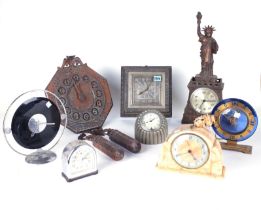 SEVEN 20TH CENTURY CLOCKS, INCLUDING ARTS AND CRAFTS EXAMPLES AND AN EARLY AMERICAN SOUVENIR...
