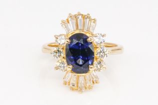 A SAPPHIRE AND DIAMOND RING