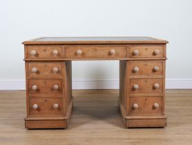 A VICTORIAN OAK NINE DRAWER PEDESTAL DESK