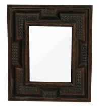 A 19TH CENTURY BLACK FOREST CARVED LIMEWOOD MIRROR