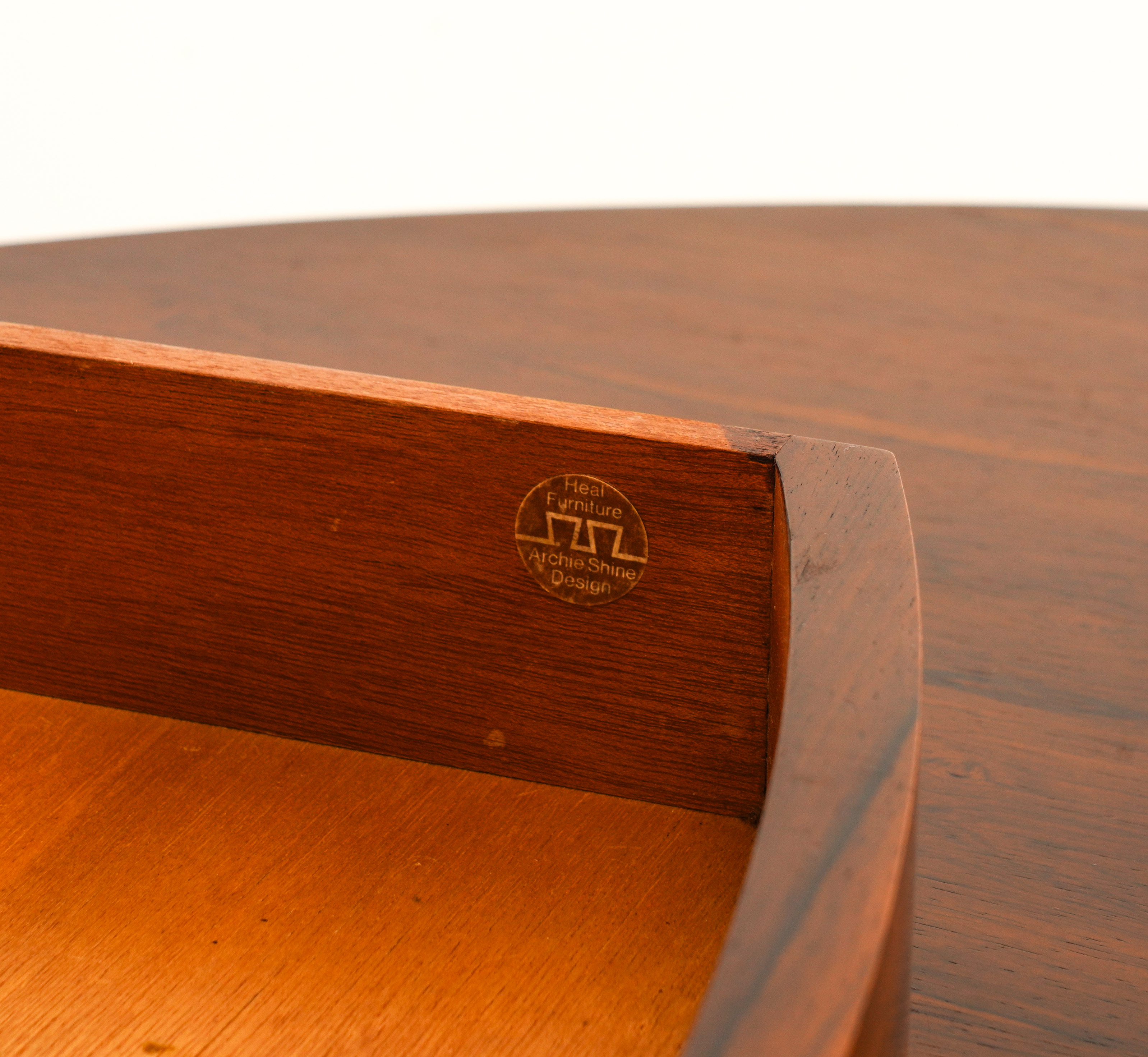 ARCHIE SHINE FOR HEALS FURNITURE; A MID 20TH CENTURY ROSEWOOD CIRCULAR DINING TABLE - Image 7 of 7