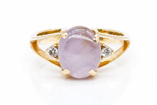 A GOLD, PINK STAR SAPPHIRE AND DIAMOND THREE STONE RING