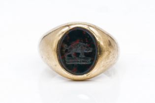 A GOLD AND BLOODSTONE OVAL SIGNET RING
