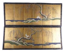 A PAIR OF JAPANESE GILT AND POLYCHROME DECORATED SIX FOLD SCREENS (2)