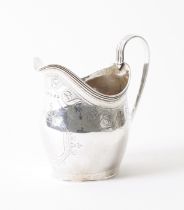 A GEORGE III SILVER CREAM JUG