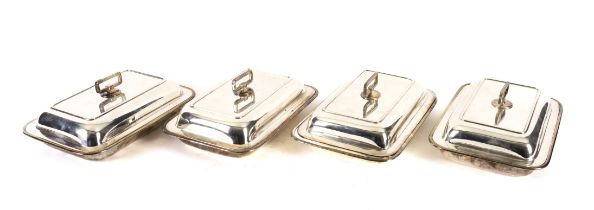 A SET OF FOUR THAI SILVER RECTANGULAR LIDDED ENTREE DISHES