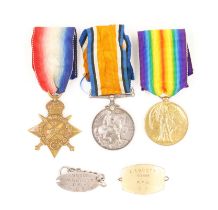 THREE FIRST WORLD WAR MEDALS AND TWO IDENTITY PANELS (5)