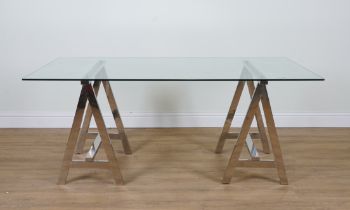 A CHROME AND GLASS RECTANGULAR DINING TABLE