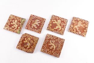 A GROUP OF SIX MEDIEVAL STYLE SLIP DECORATED TILES (6)