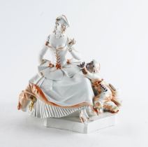 A MEISSEN FIGURE OF A LADY WITH A MOOR ATTENDANT