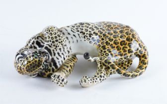 A NYMPHENBURG PORCELAIN FIGURE OF A LEOPARD `AMIDOU'