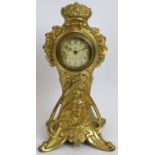 An antique Art Nouveau French gilt metal clock with case designed by C Bonnefond. Height 31.5cm.