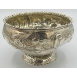 A fine Victorian silver pedestal bowl, embossed with scrolls and flowers. Approx: 5" across and 3"