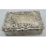 A heavy Victorian silver table snuff box with presentation inscription and scrolls and flowers, with