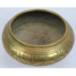 A Chinese brass censer of squat form with engraved design to body and six character mark to base.