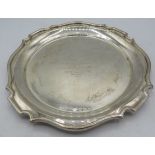 A silver salver 8" across engraved with signatures and 'Hazards Golfing Society'. Birmingham 1932.