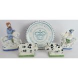 Five pieces of Rye pottery including two Canterbury Tales figures, A Diamond Jubilee plate and a
