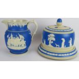 A Copeland blue painted stoneware cheese bell in Jasperware style and a similar Columbus 400th