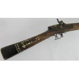 An antique Afghan percussion cap Jezail rifle with mother of pearl inlaid stock. Overall length