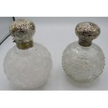 Two large hobnail cut scent bottles with silver embossed tops. London 1893 and one with worn