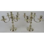 A pair of four branch silver candelabra. Approx: 12" high. London 1966 and 1967 weighted. Total