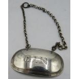 A Victorian silver 'gin' label. London 1842. 6 grams. Condition report: Good condition.