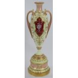 An Edwardian Royal Worcester Pate-sur-pate urn vase with gilt and pink decoration over an ivory