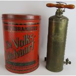 A large vintage Belgian coffee tin with red and gold finish and a vintage brass 'four oaks' garden