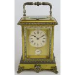 An ornate gilt and silver plated brass Repeater carriage clock with strike and alarm movement,