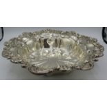 A large silver bowl with elaborate scroll and flower edge. Approx: 11" across. Birmingham 1904. 14.7