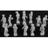 Twelve small German porcelain Blanc de Chine figures of young boys in various traditional poses. All