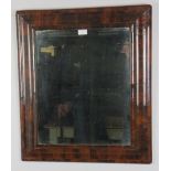 A 17th century William & Mary Period walnut oyster veneer cushion frame wall mirror, retaining the