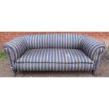 A Victorian Chesterfield sofa, reupholstered in a contemporary striped material with braided rope