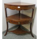 A George III walnut two-tier corner washstand, strung with satinwood and ebony, on splayed