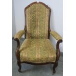 A vintage French oak show-wood open-sided armchair, upholstered in tapestry patterned material