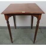 An Edwardian Regency Revival mahogany and oak square lamp table, on tapering fluted supports.