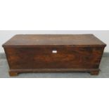 An early 19th century elm trunk of small proportions, on bracket feet. Condition report: Various