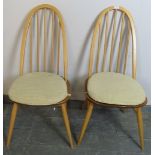 A pair of mid-century elm and beech blond Ercol Windsor Quaker dining chairs, on turned canted