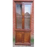A Victorian burr walnut tall display bookcase, the glazed doors opening onto four height