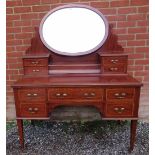 An Edwardian mahogany Regency Revival, c.1900, dressing table featuring crossbanded satin walnut